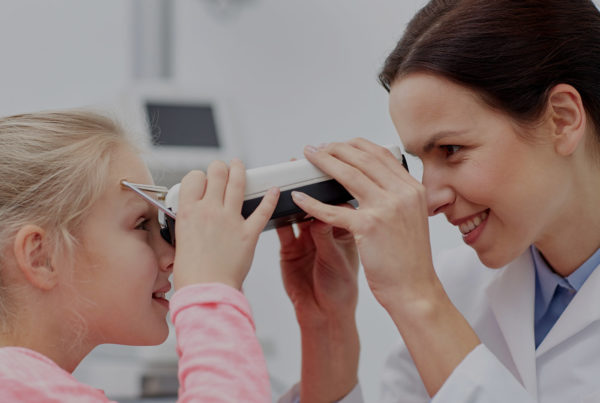 Child getting eye exam at Durham Vision Care